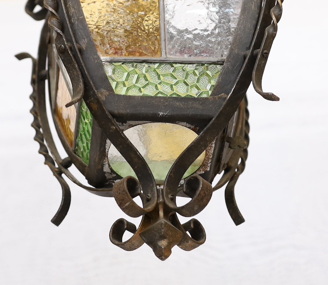 A 1940s-50s French wrought iron and stained glass hall lantern, height 60cm. width 28cm